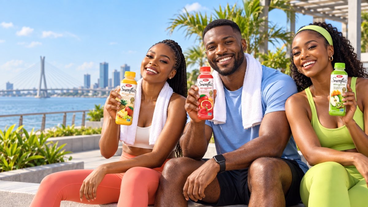 Stylish Nigerian friends in modern sportswear holding colourful OKF Korean smoothie bottles